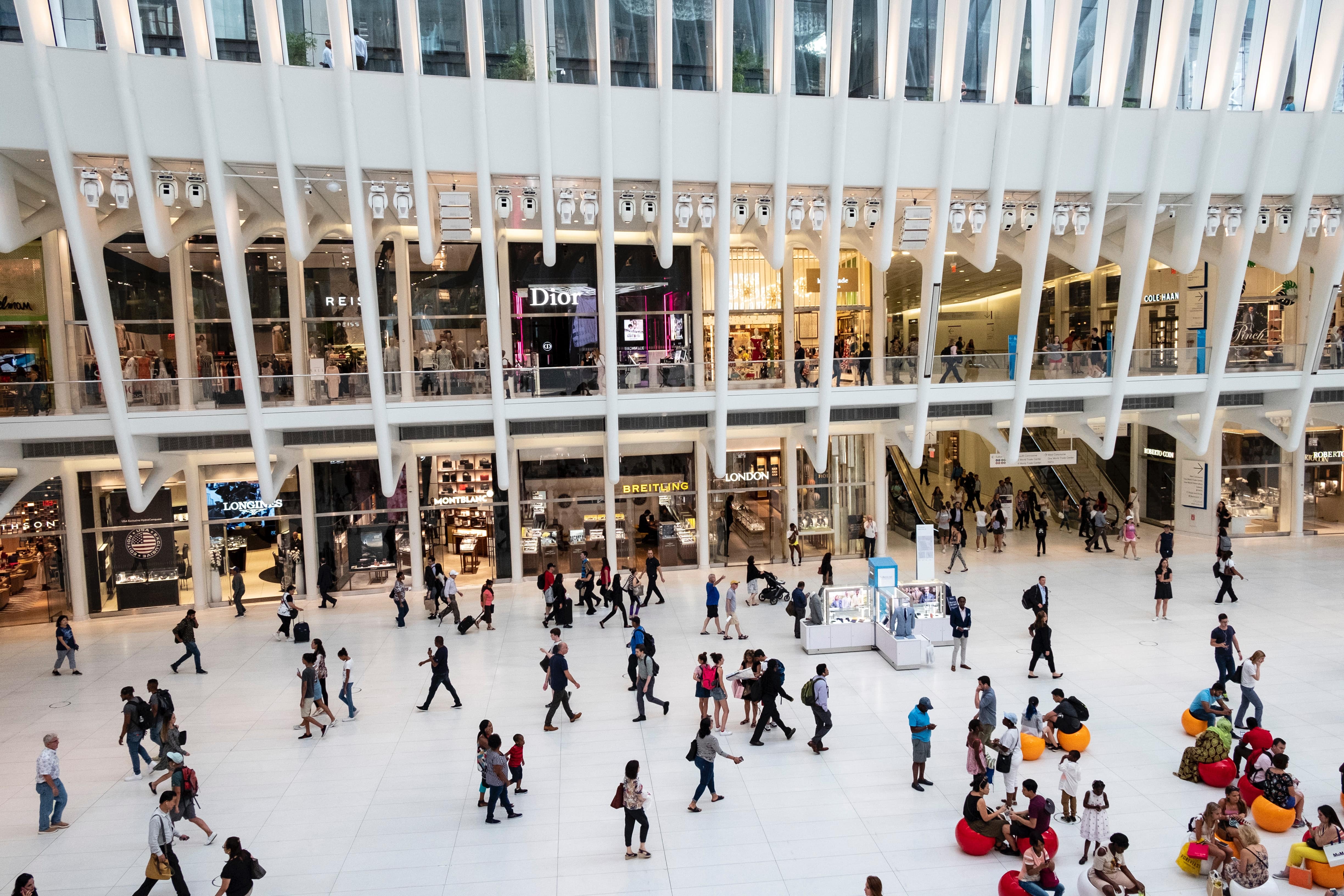 People at a shopping mall scurrying around