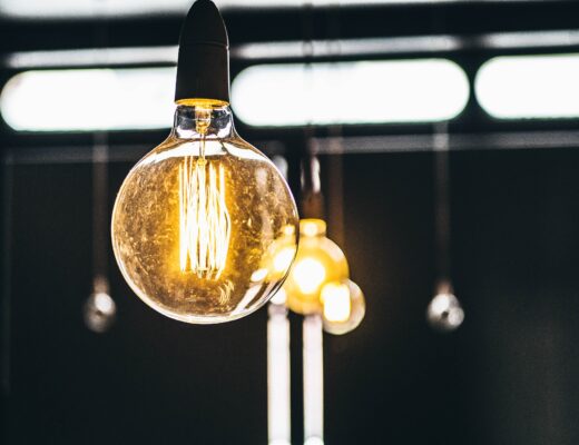 A row of lightbulbs that are turned on